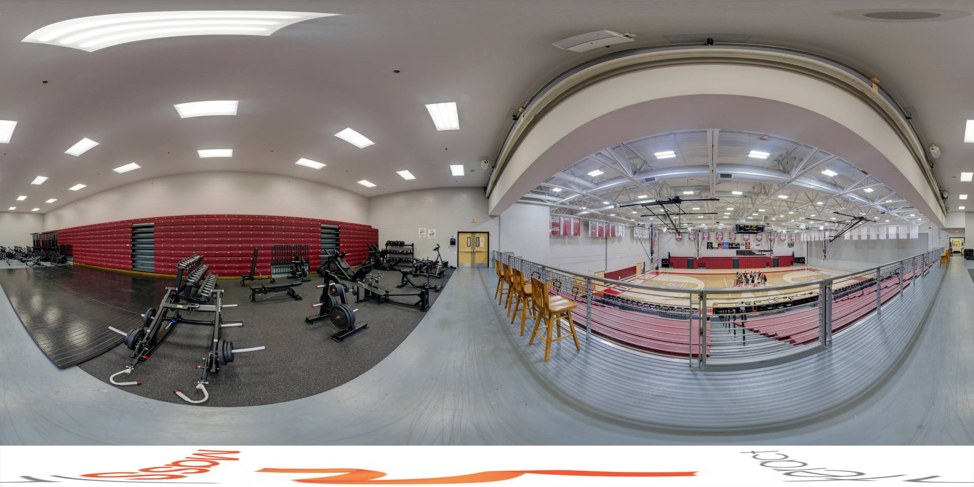 Panoramic view of a multi-functional gym with a basketball court and fitness equipment under bright lights